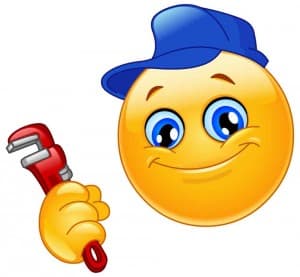 Cheerful yellow smiley face wearing a blue cap, holding a red wrench and smiling brightly.