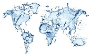 World map created with blue water splashes and liquid droplets on a white background.