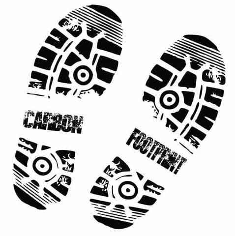 Two black shoe sole prints with text reading CARBON and FOOTPRINT, showing tread patterns and circular heel designs.