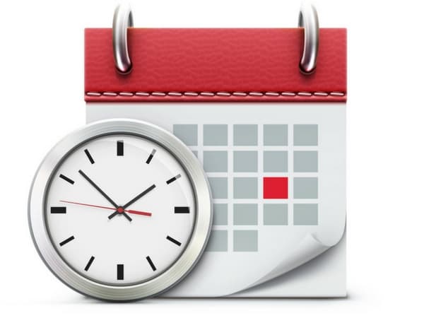 Analog clock next to a calendar with a red highlighted date, representing time management and scheduling.