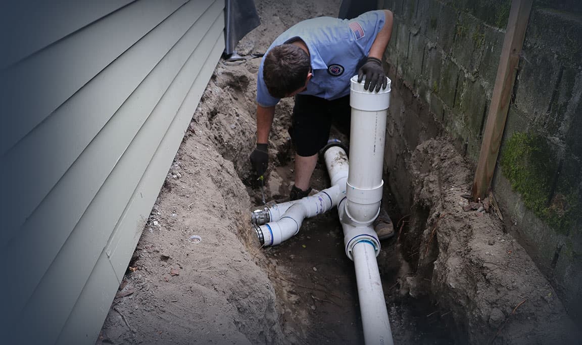 A plumber performing sewer line repair services for a home in Lynnwood, WA
