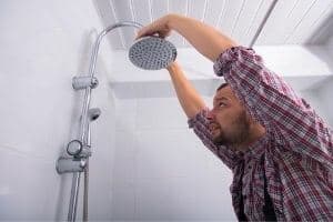 a shower head being fixed